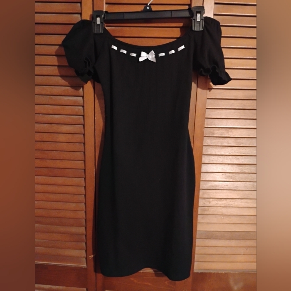 Liz And Sara Elegant Black Mini Dress with White Bow And Stitching Accents.
